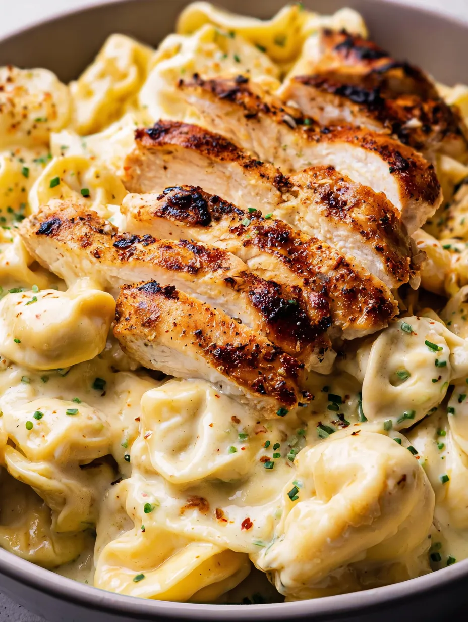 A plate of food with chicken and pasta.