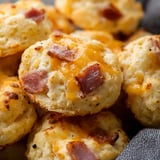 Bacon and cheese biscuits on a plate.