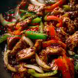 A plate of food with peppers and onions.