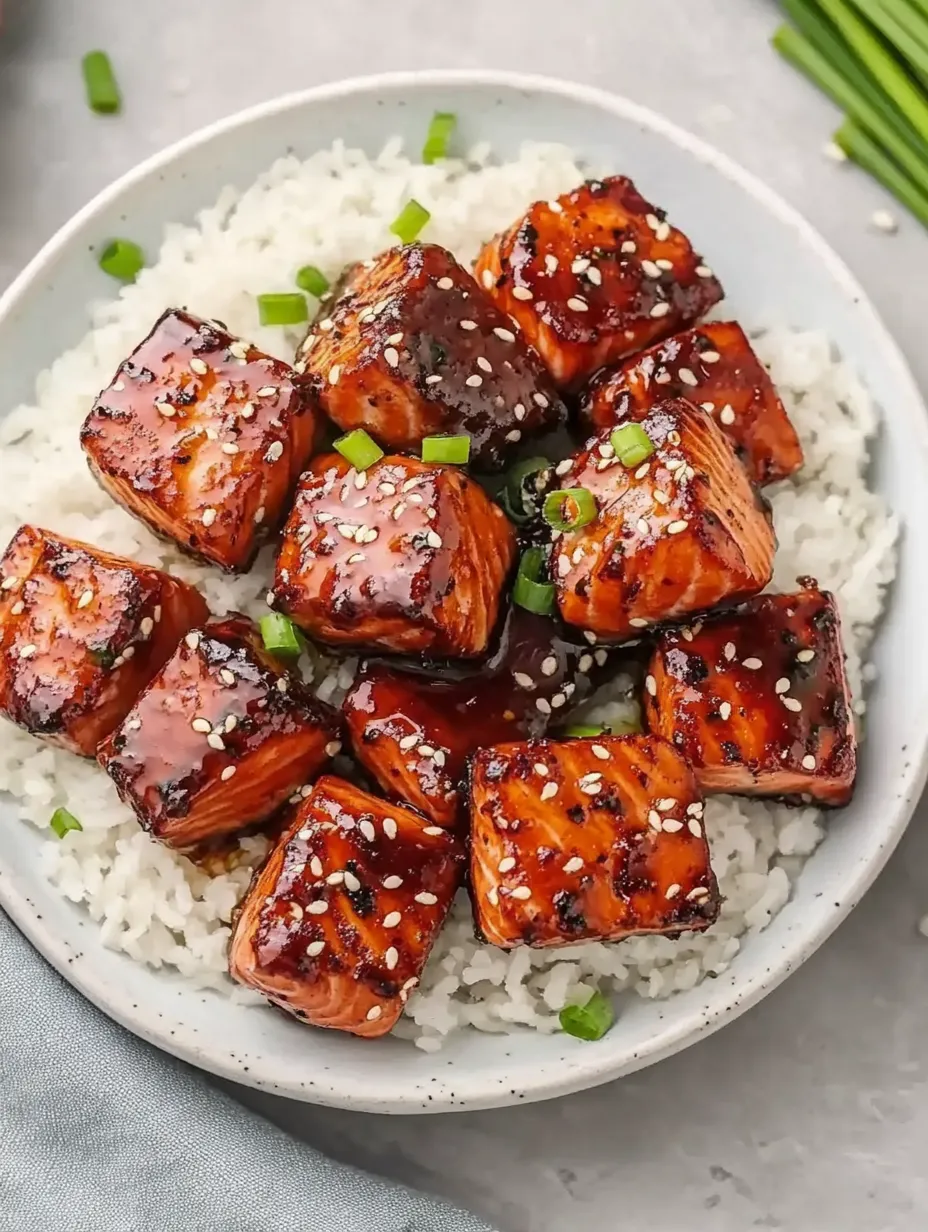 A plate of food with rice and meat on it.