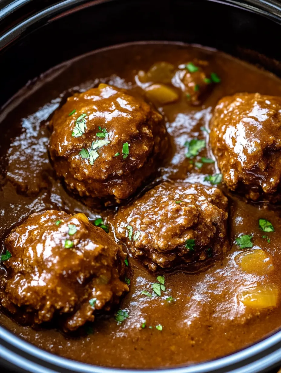 A bowl of meatballs in a brown sauce.