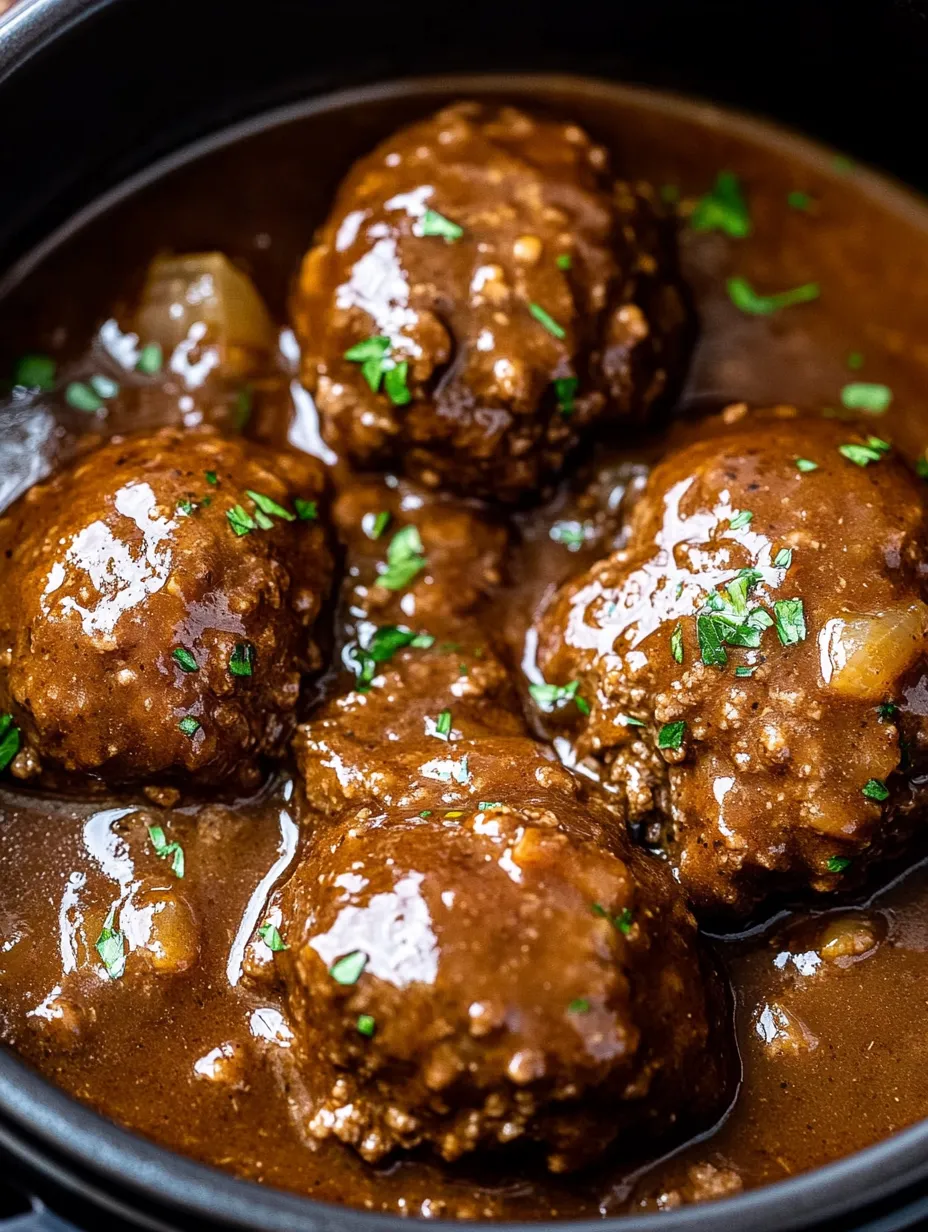 A bowl of meatballs in a brown sauce.