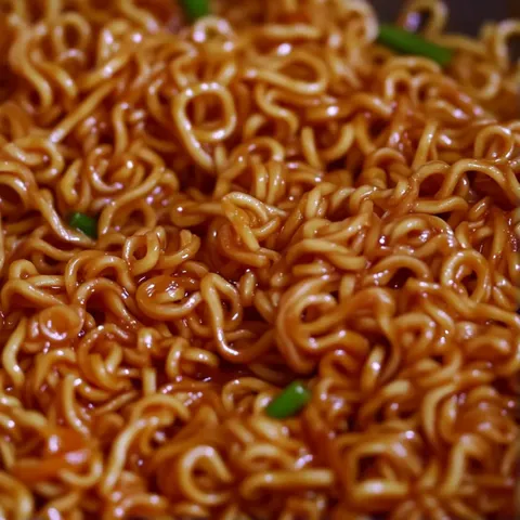 A close up of a bowl of noodles.