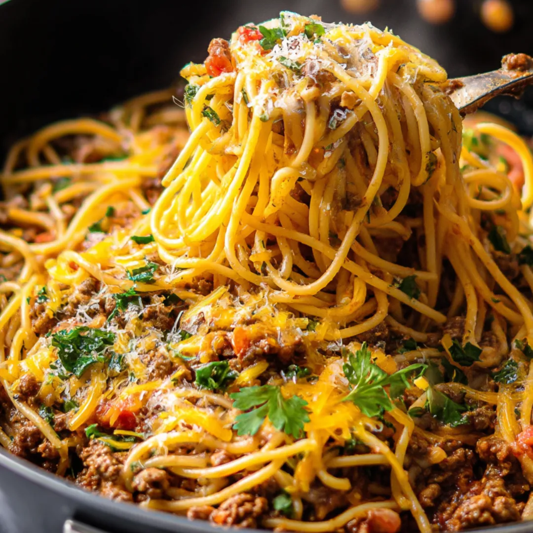 A bowl of spaghetti with meat sauce.
