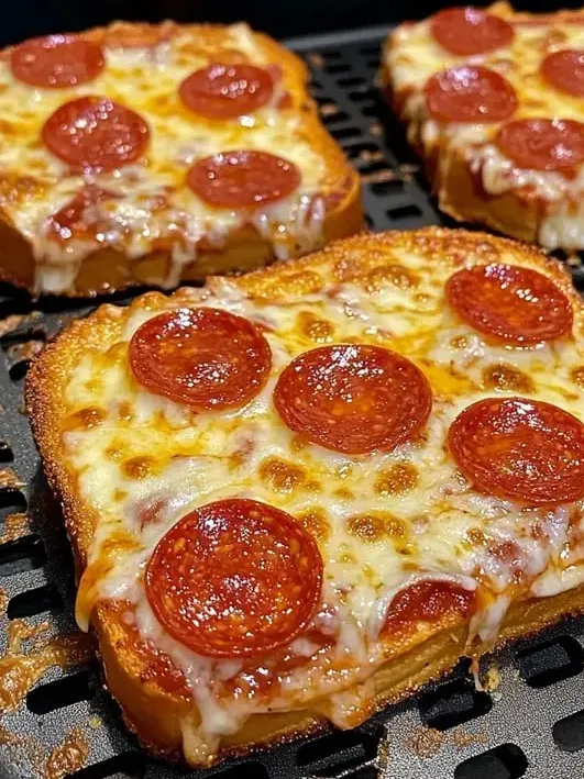 A slice of pepperoni pizza on a grill.