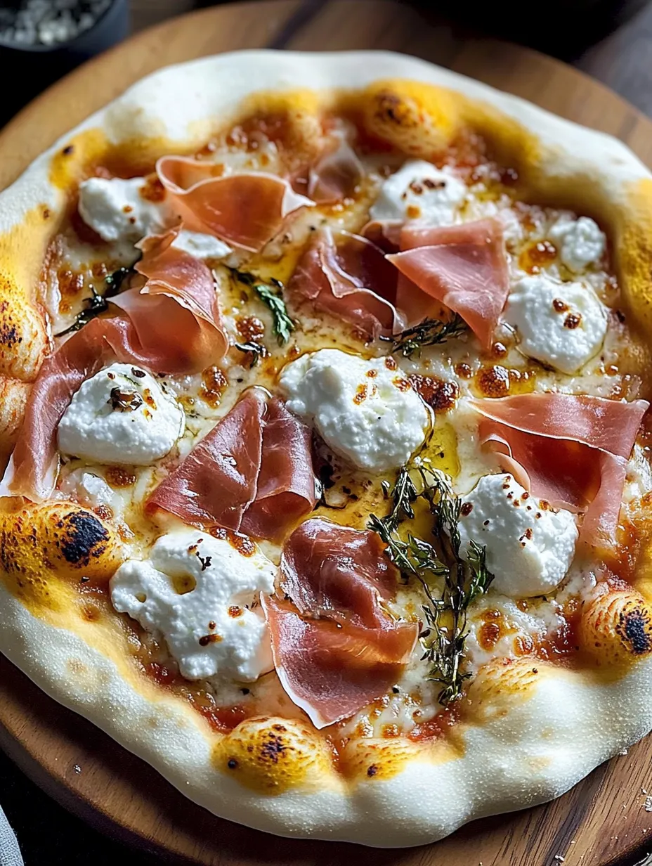A pizza with ham and cheese.