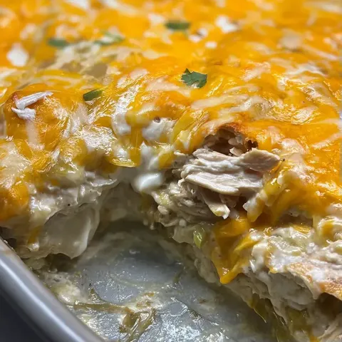 Pizza slice with chicken and cheese.
