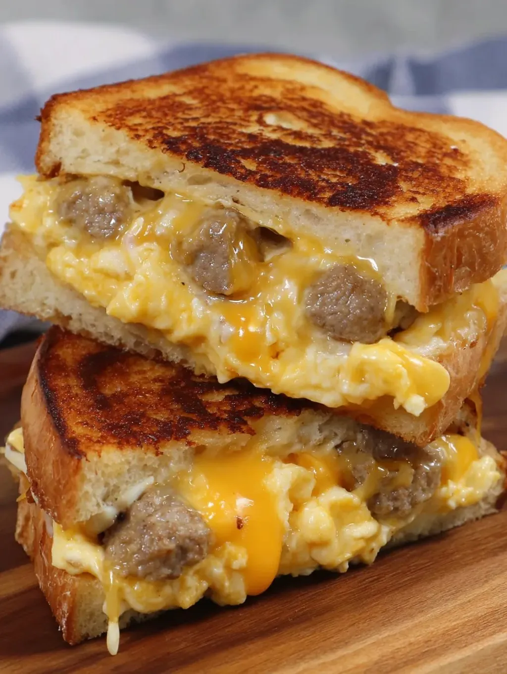 A sandwich with cheese and sausage on it.