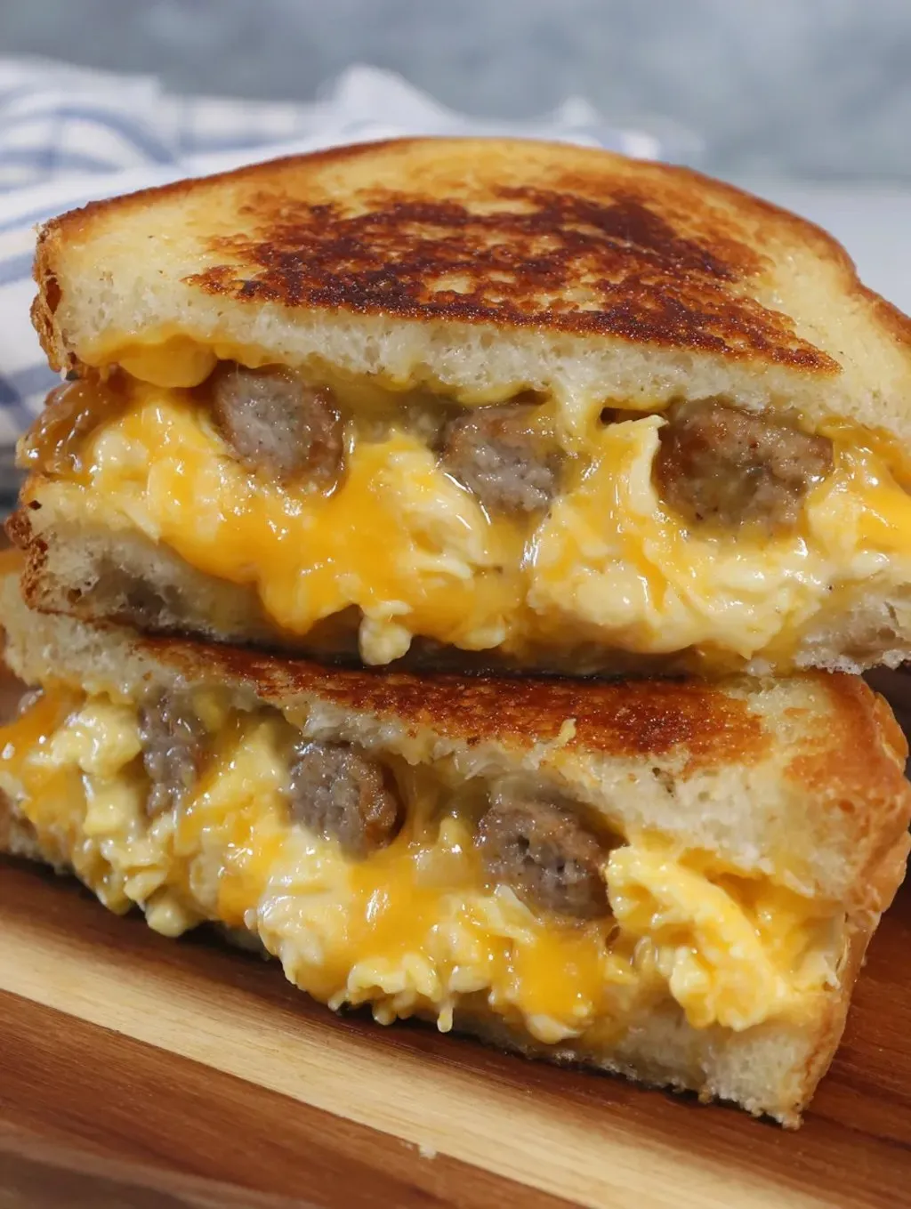 A sandwich with cheese and sausage.