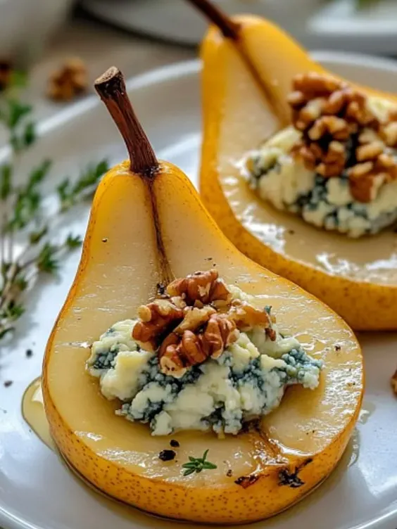 A slice of pear with a walnut on top.