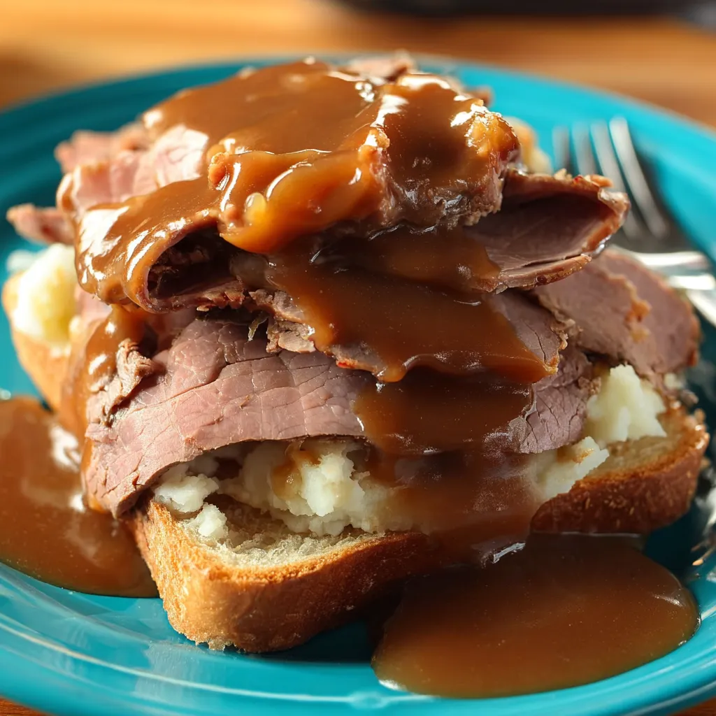 A plate of meat covered in gravy.