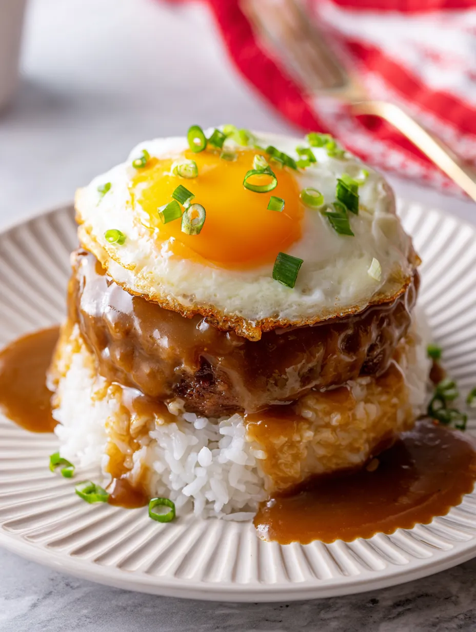 A plate of food with a fried egg on top.