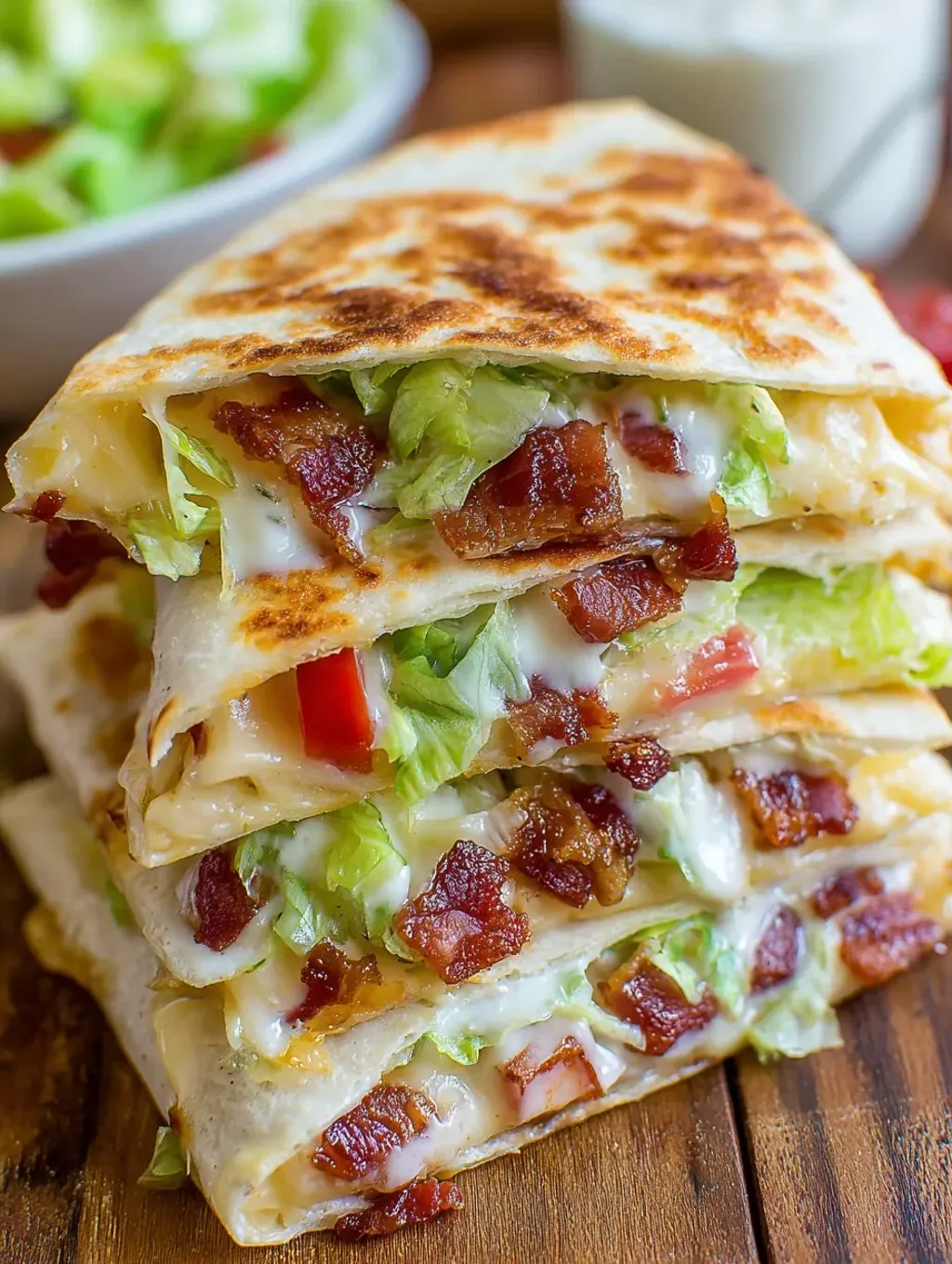 A stack of bacon and lettuce sandwiches.