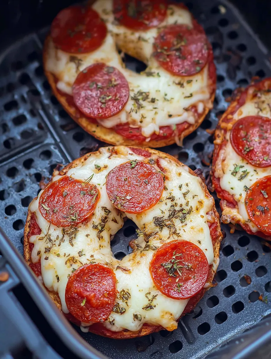 Two pepperoni pizzas on a grill.