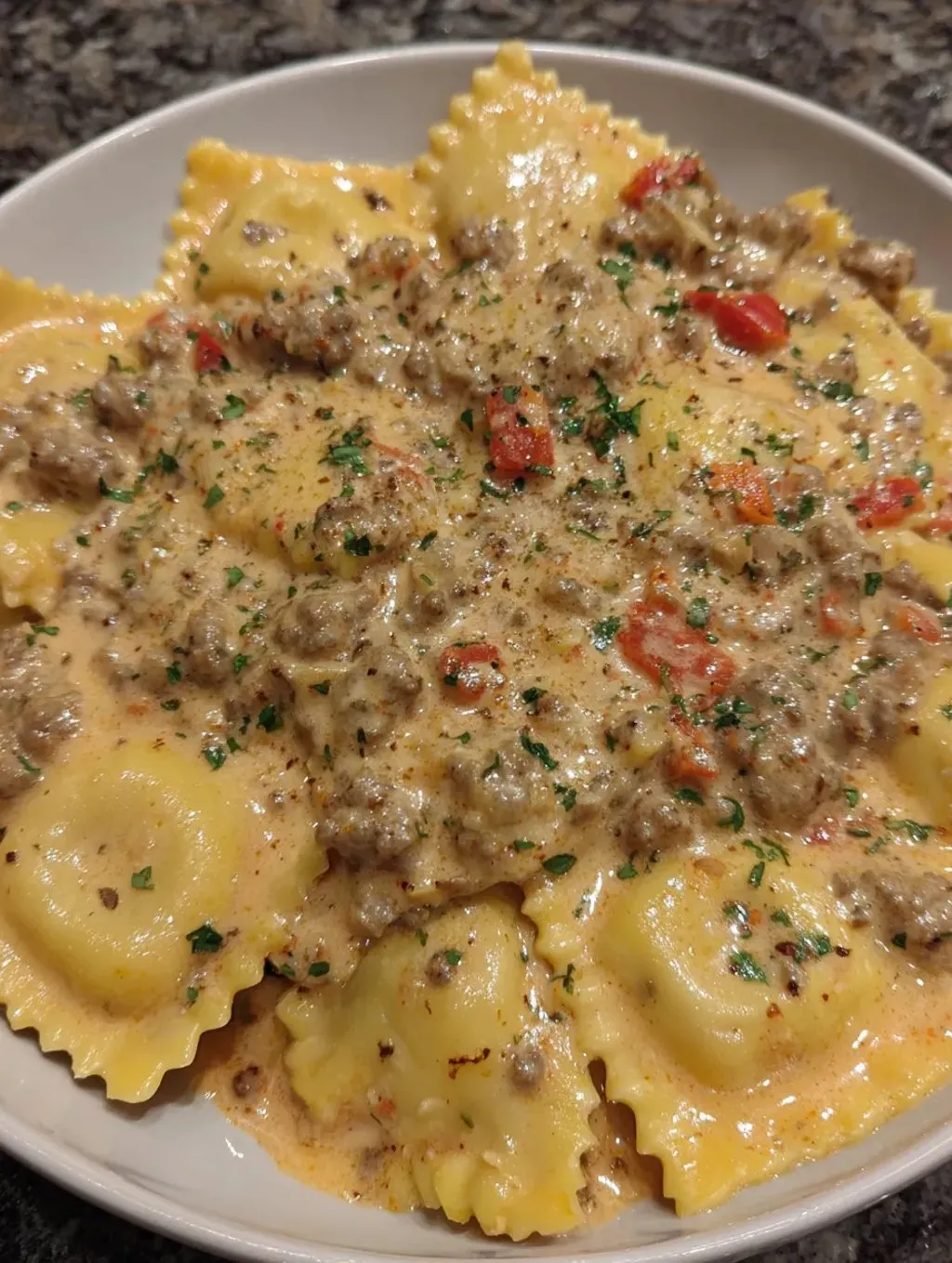 A plate of pasta with meat.