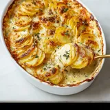 A white bowl filled with food.