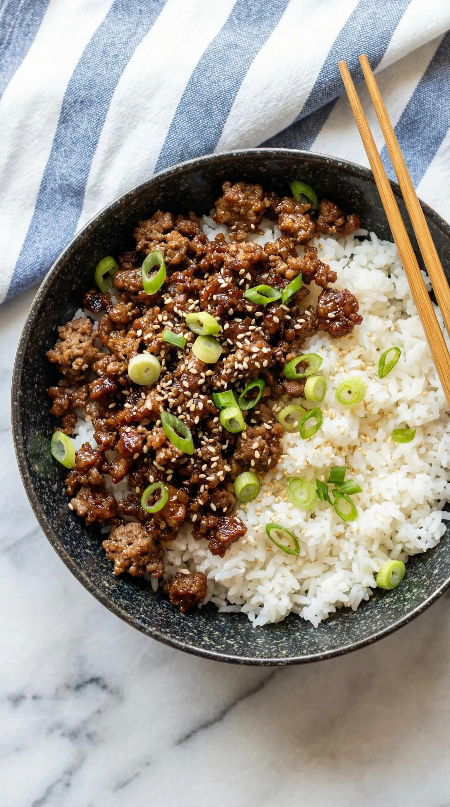 A bowl of rice and meat.