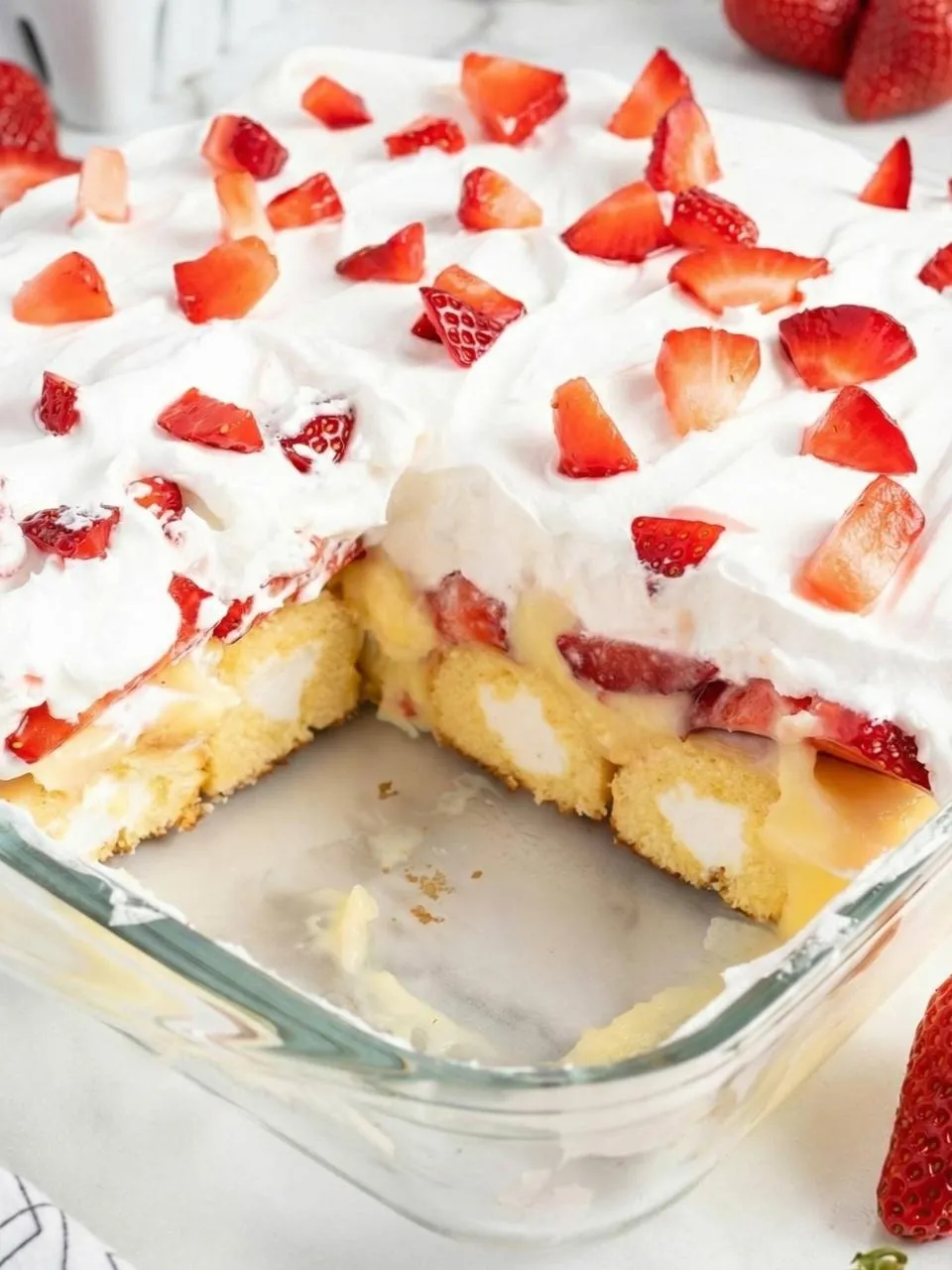 A slice of cake with strawberries on top.