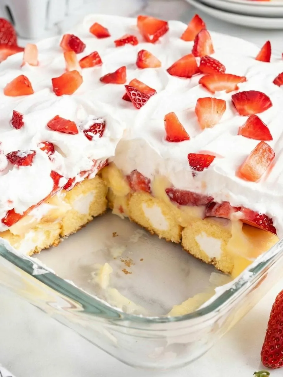 A cake with strawberries on top.