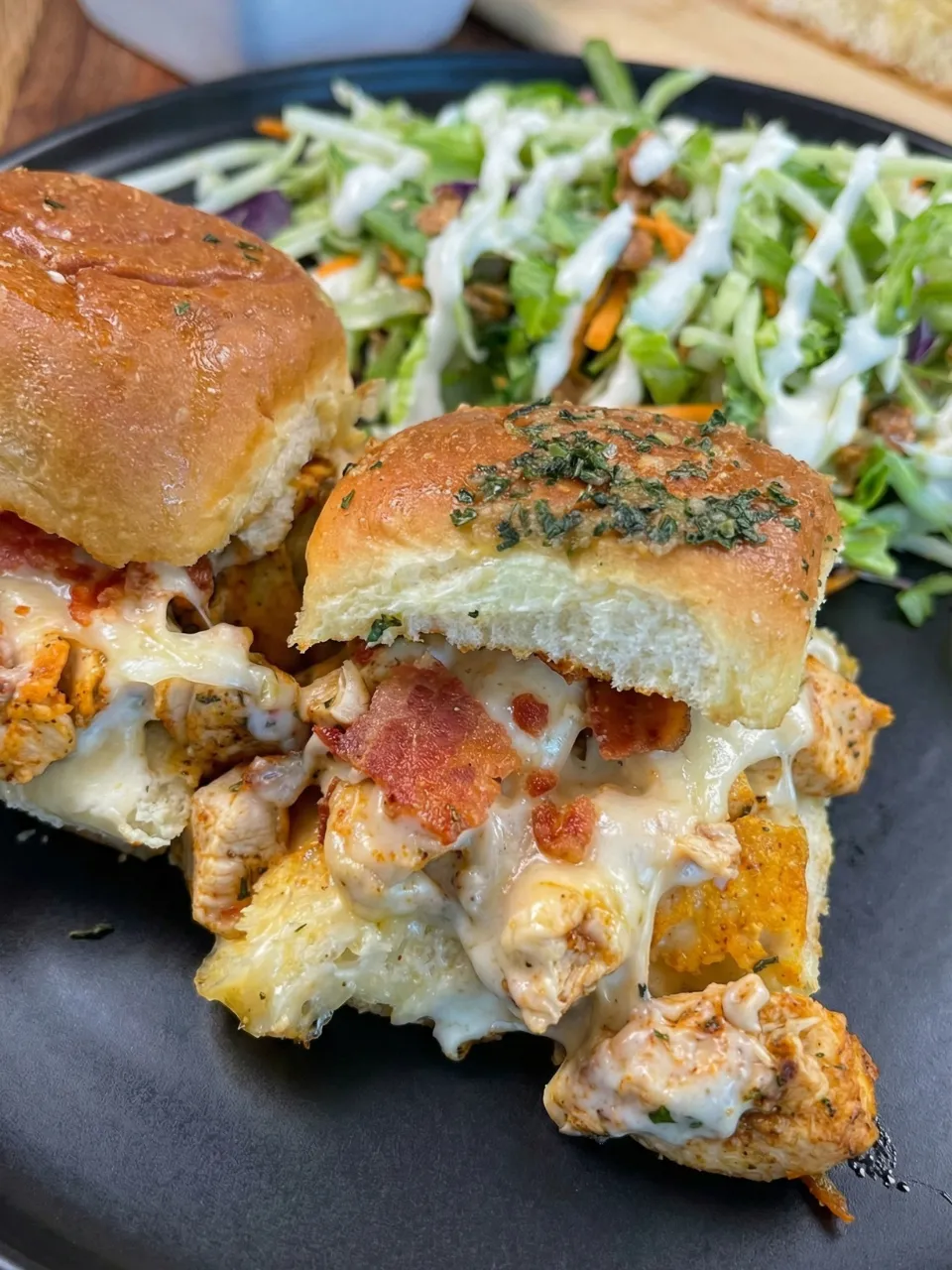 A sandwich with meat and cheese on a plate.