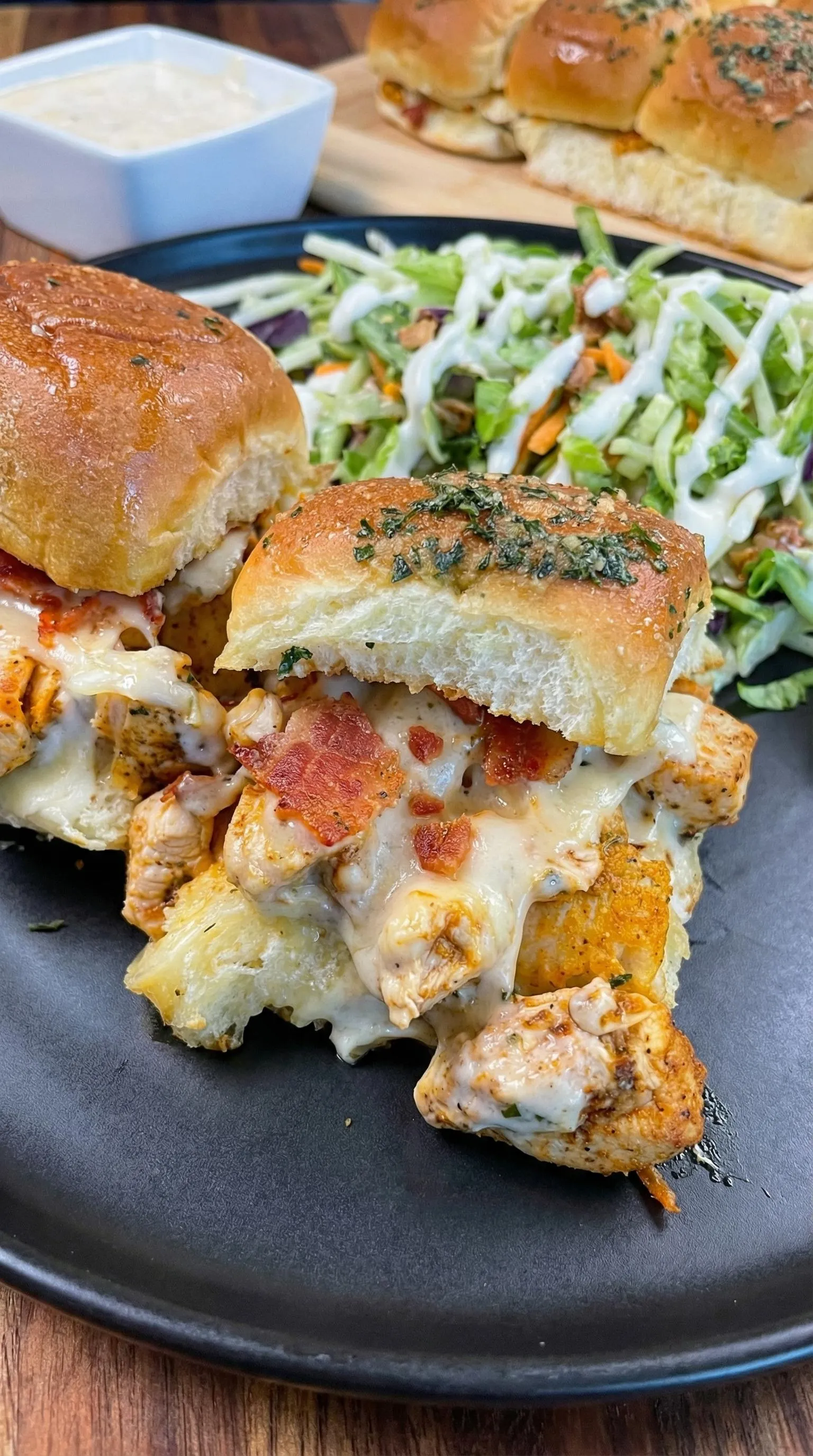 A sandwich with bacon and cheese.