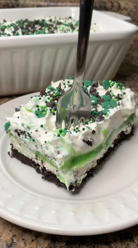 A slice of cake with a fork in it.