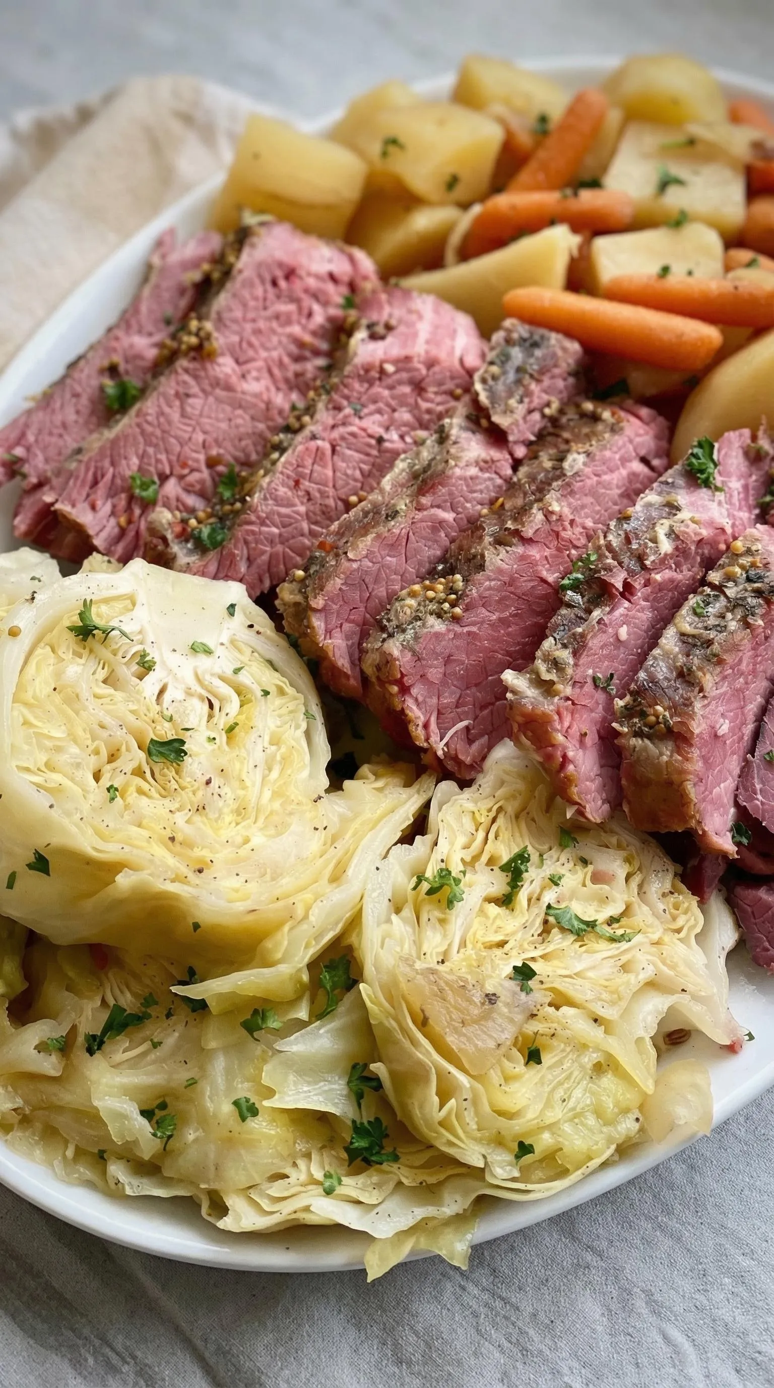 A plate of meat with vegetables.