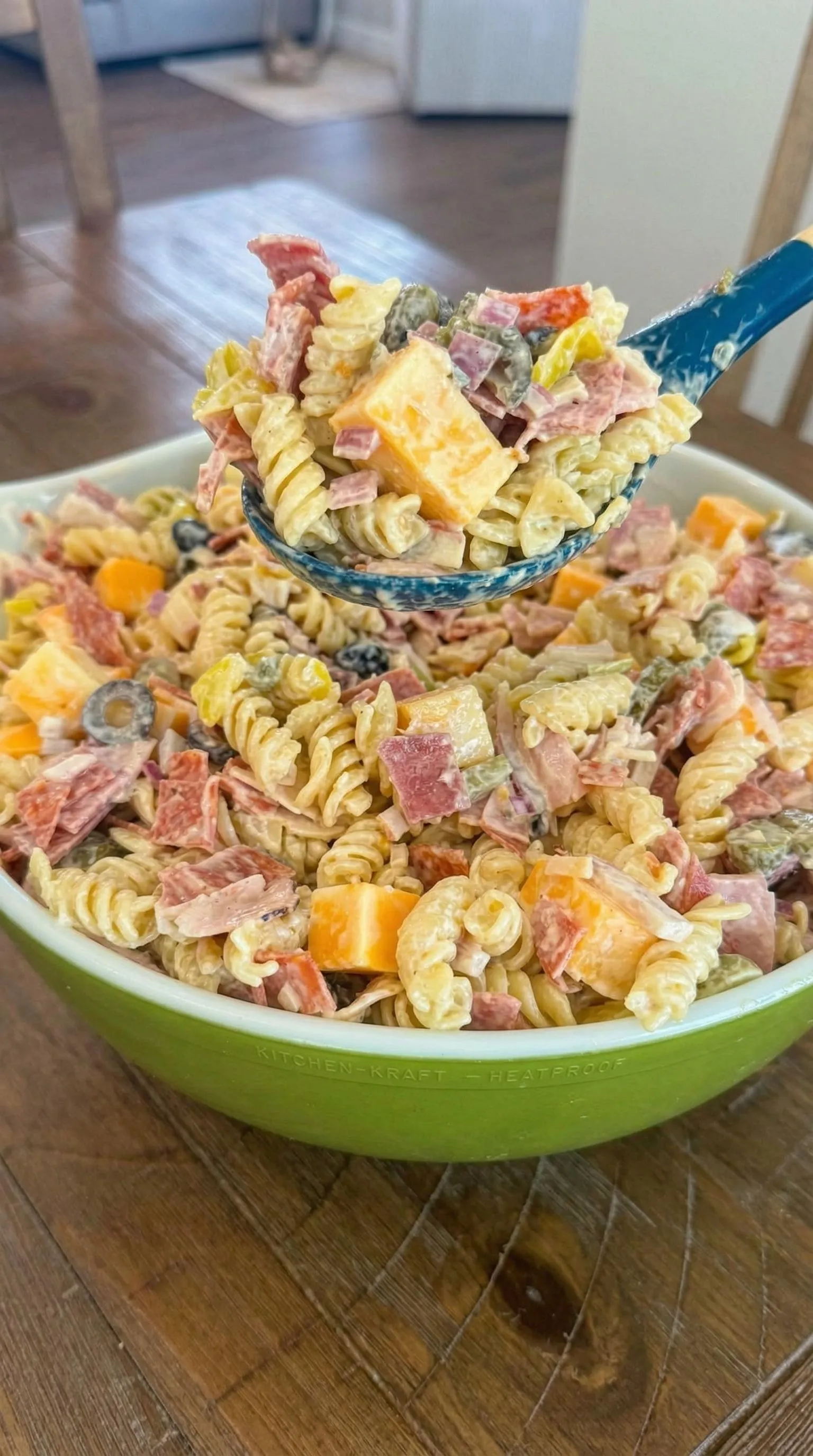 A bowl of pasta with meat and cheese.