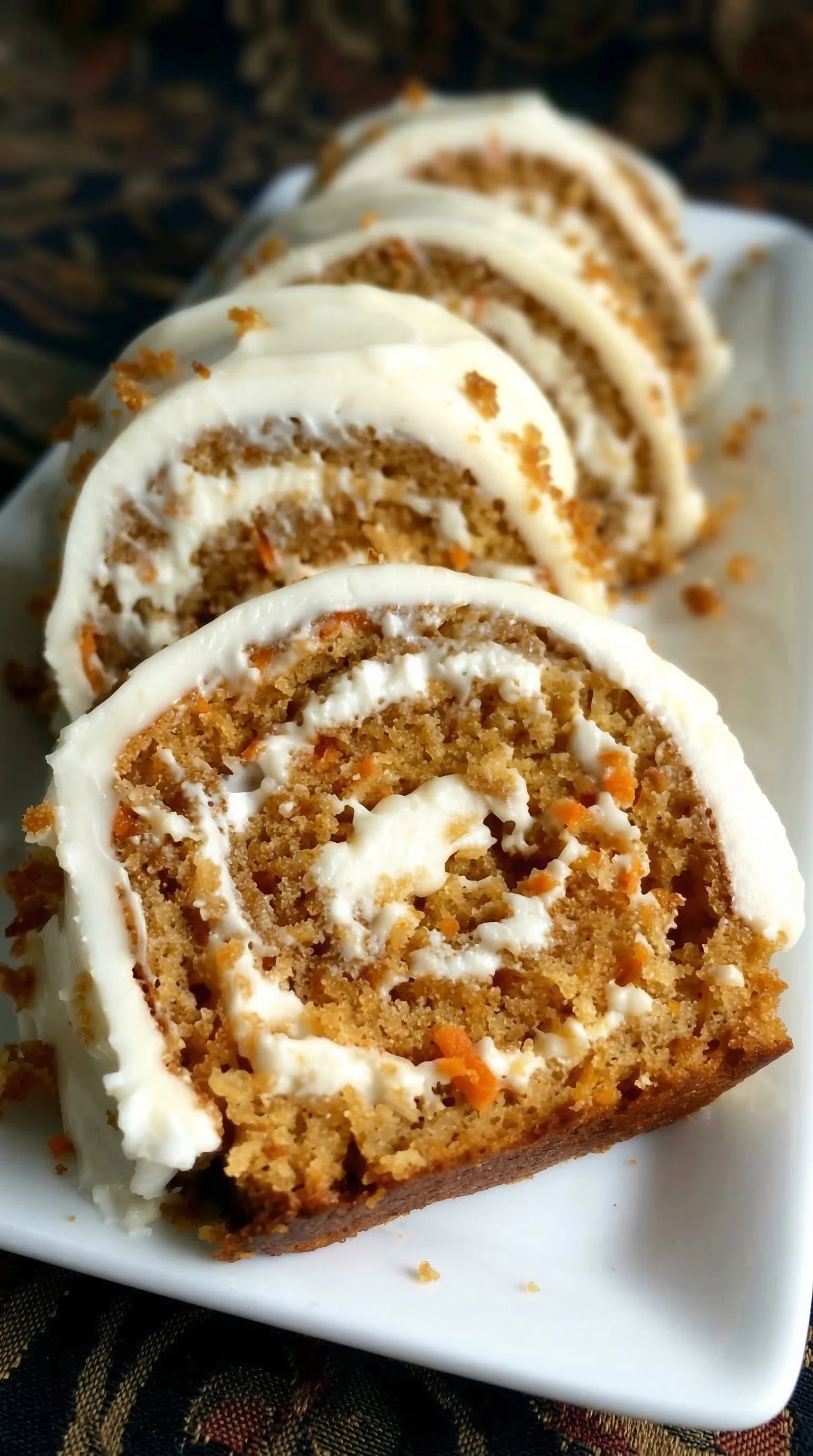 A slice of cake with white frosting.