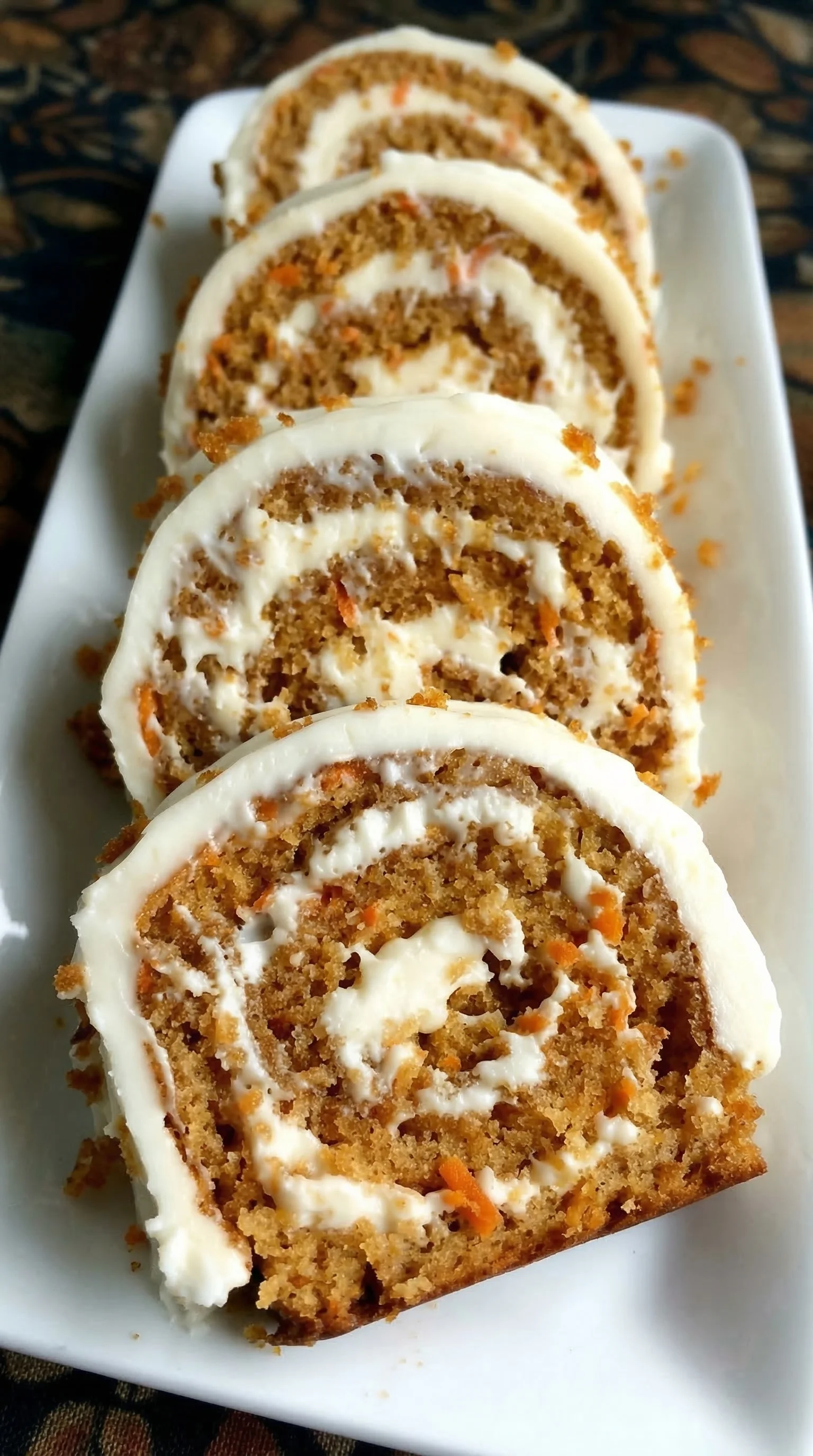 Three slices of cake on a plate.