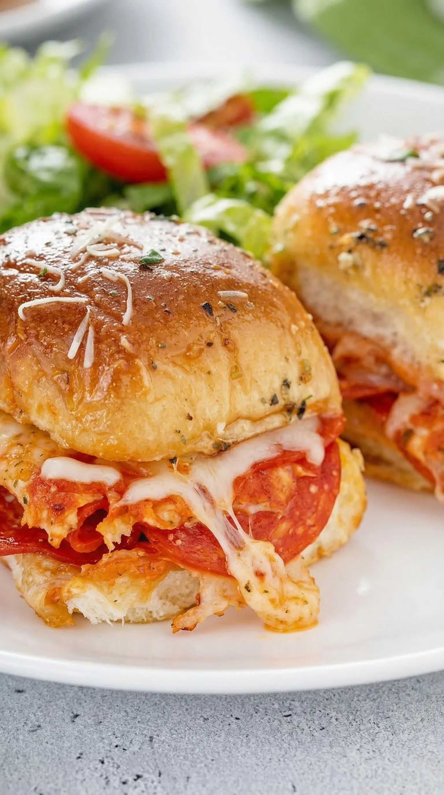 Two sandwiches with tomatoes.