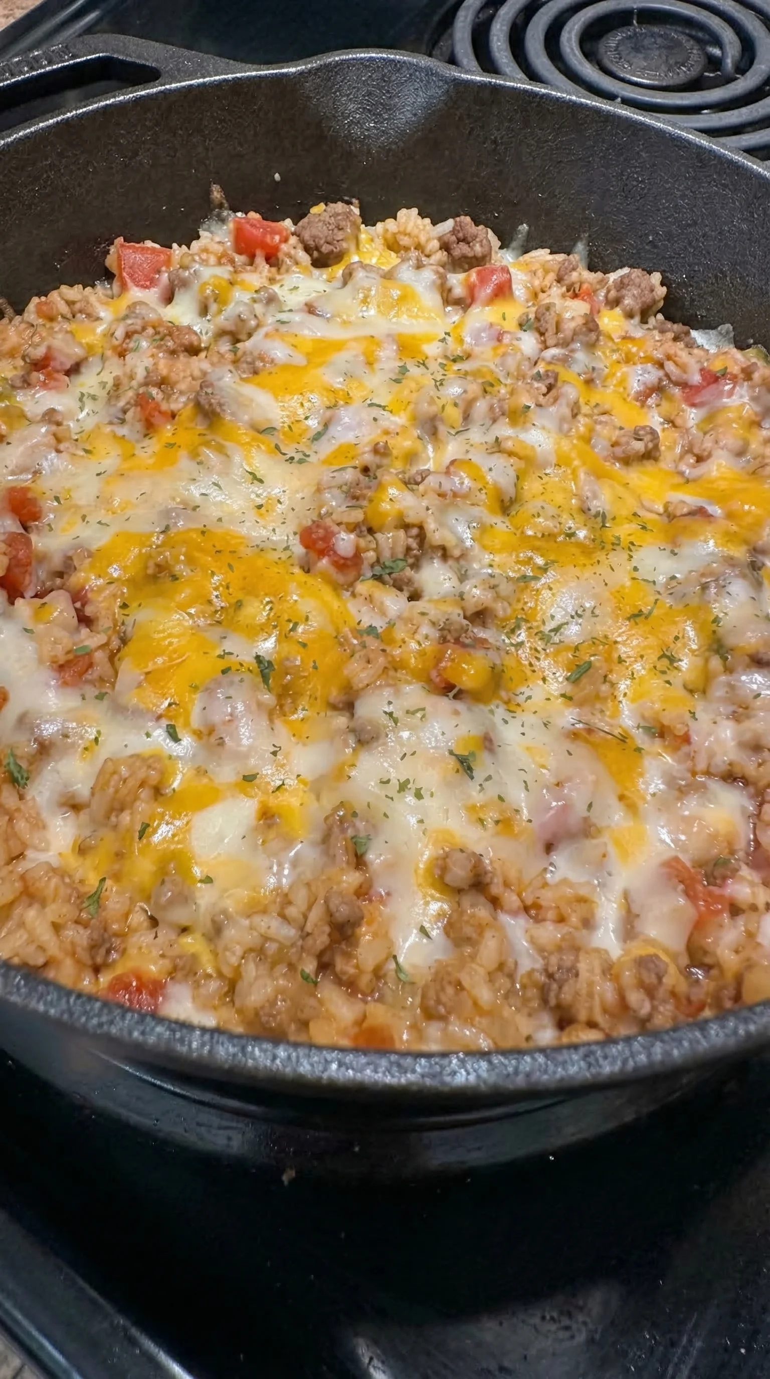A pan of food with cheese and meat.
