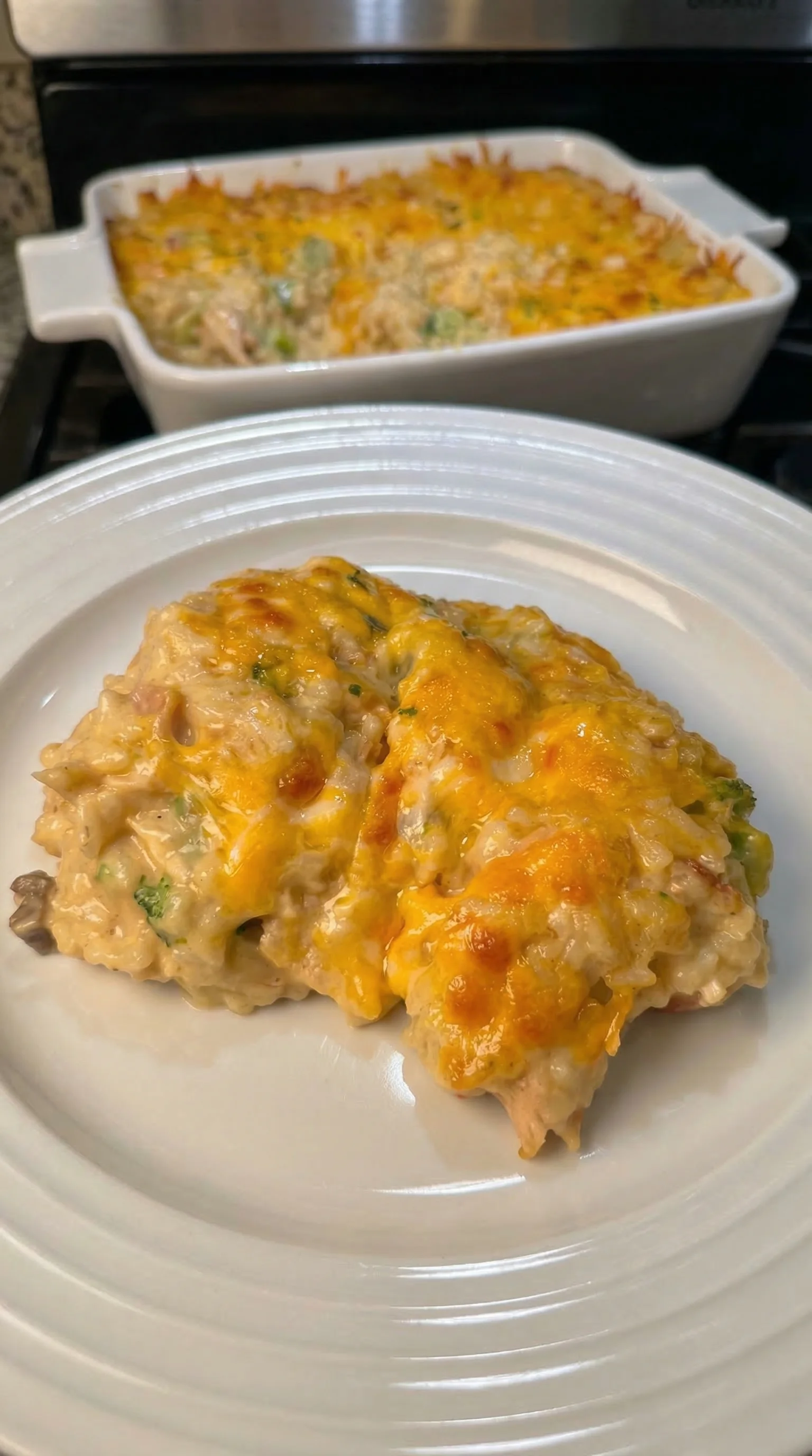 A plate of food with a piece of chicken on it.