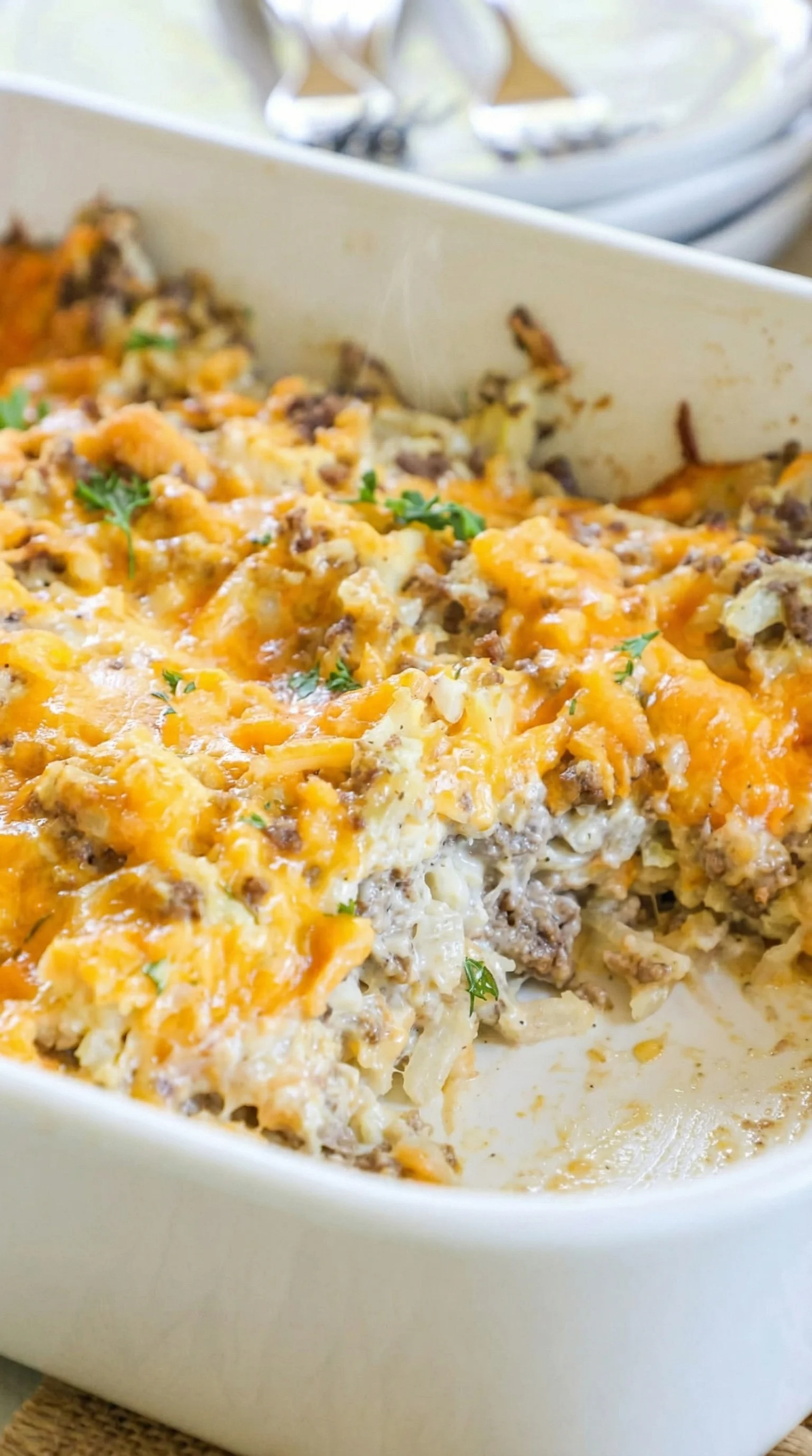 A white plate with a casserole dish on it.