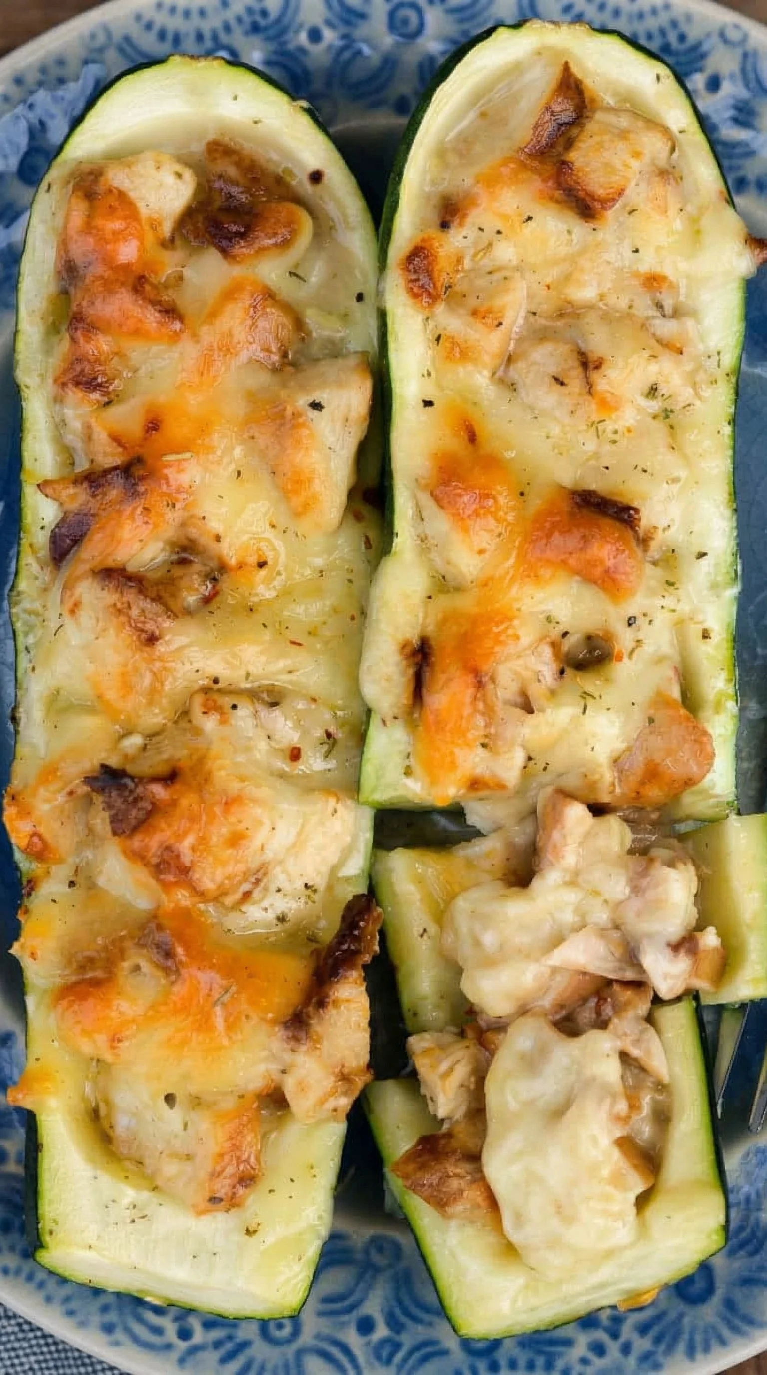 Sliced chicken with cheese and herbs.