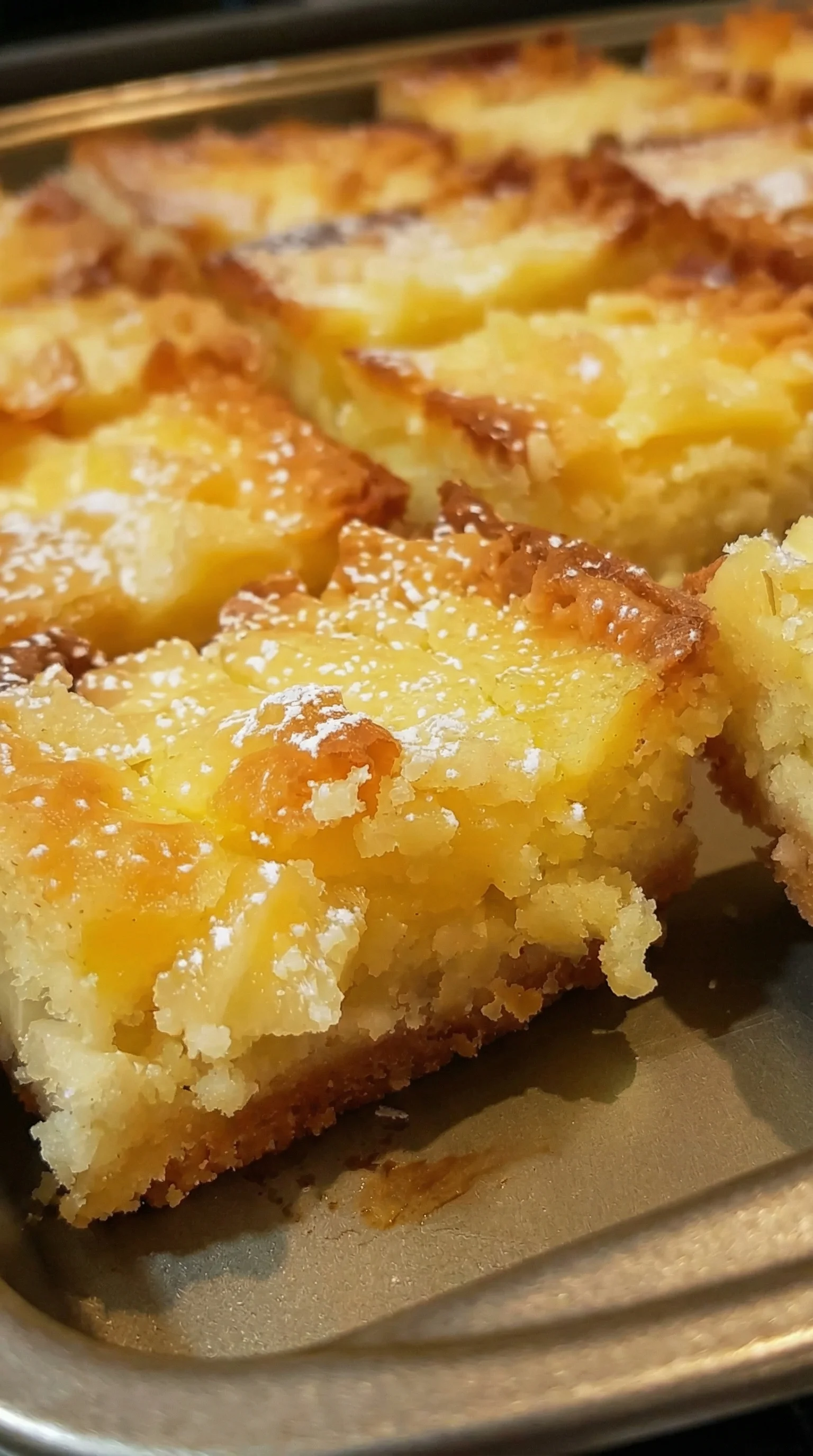A piece of cake with powdered sugar on it.