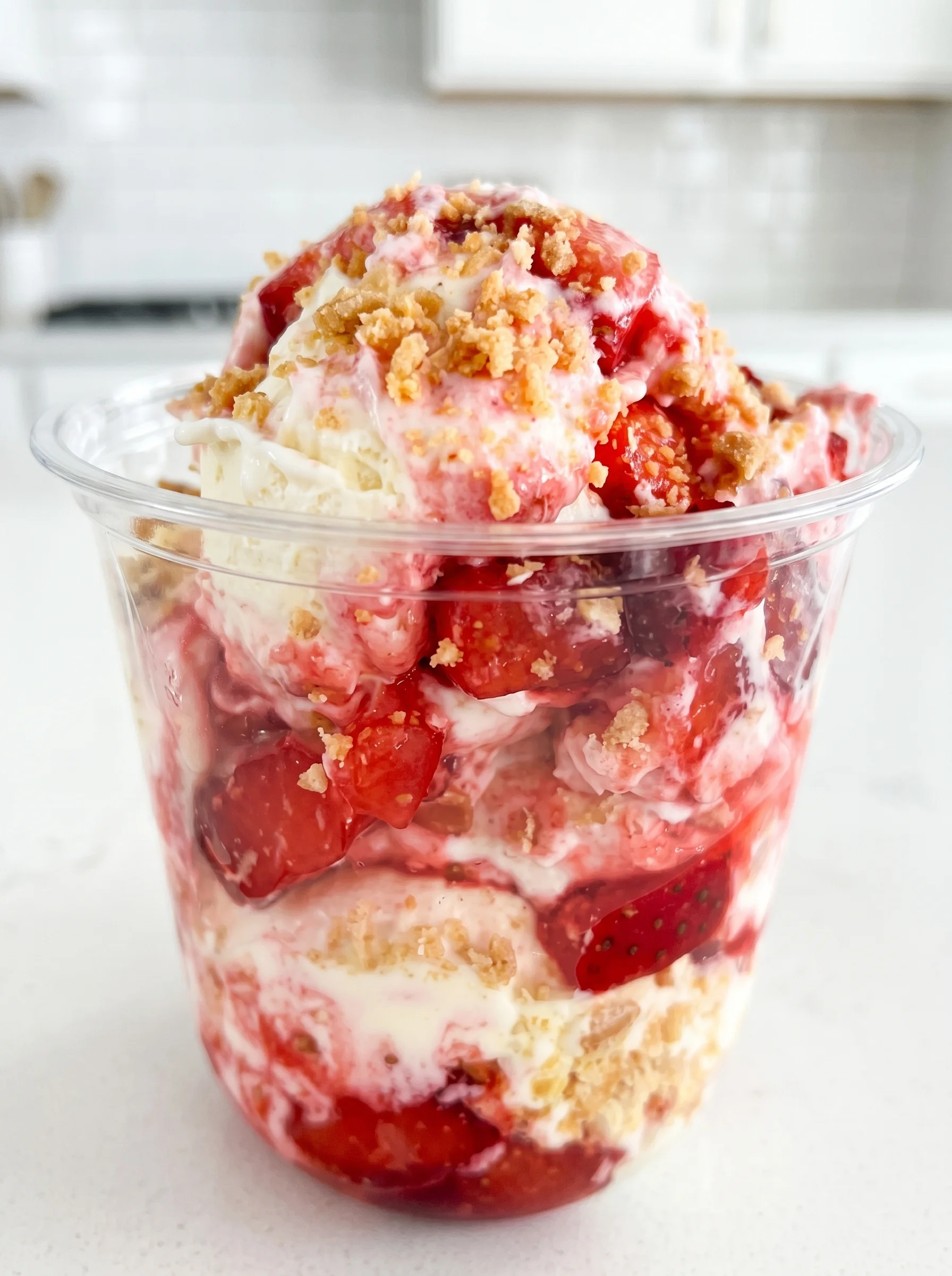 A container of strawberry crunch fluffy yogurt.