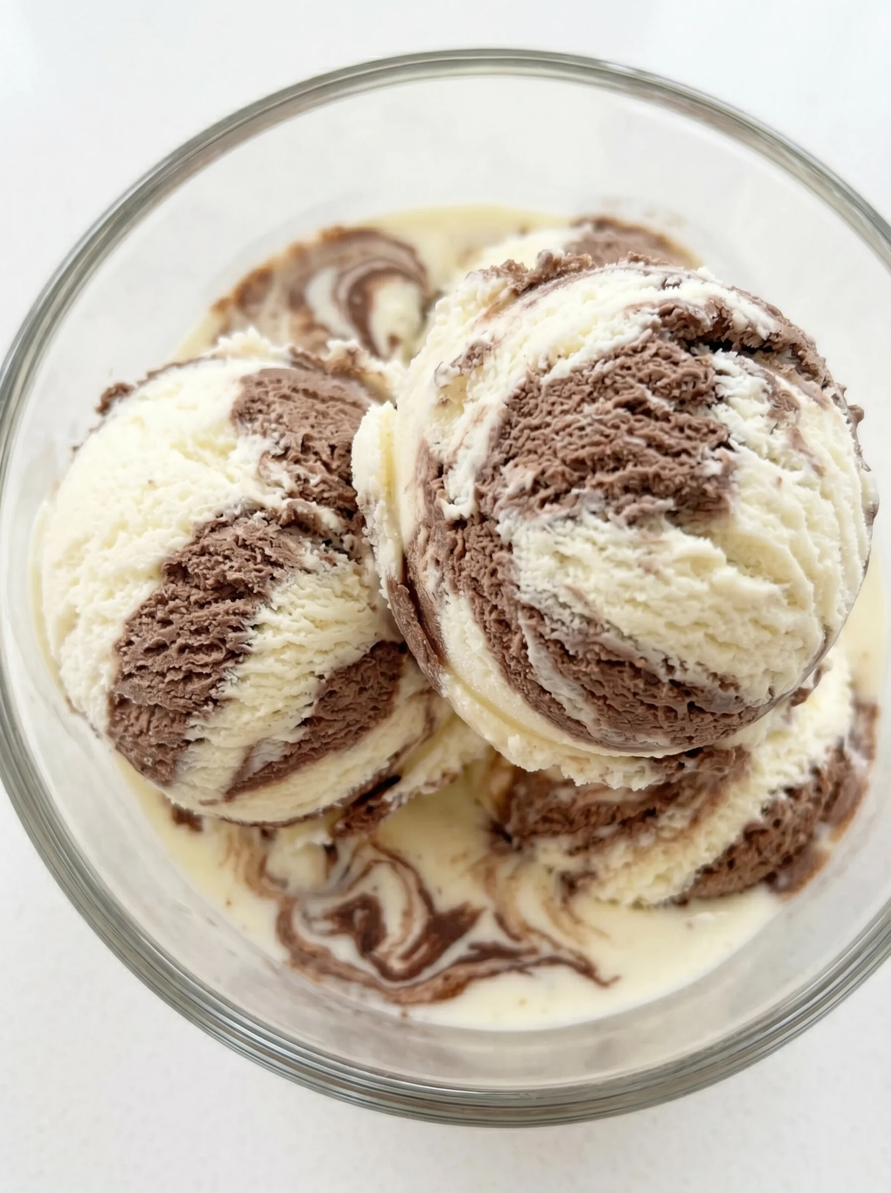 A glass bowl filled with ice cream.