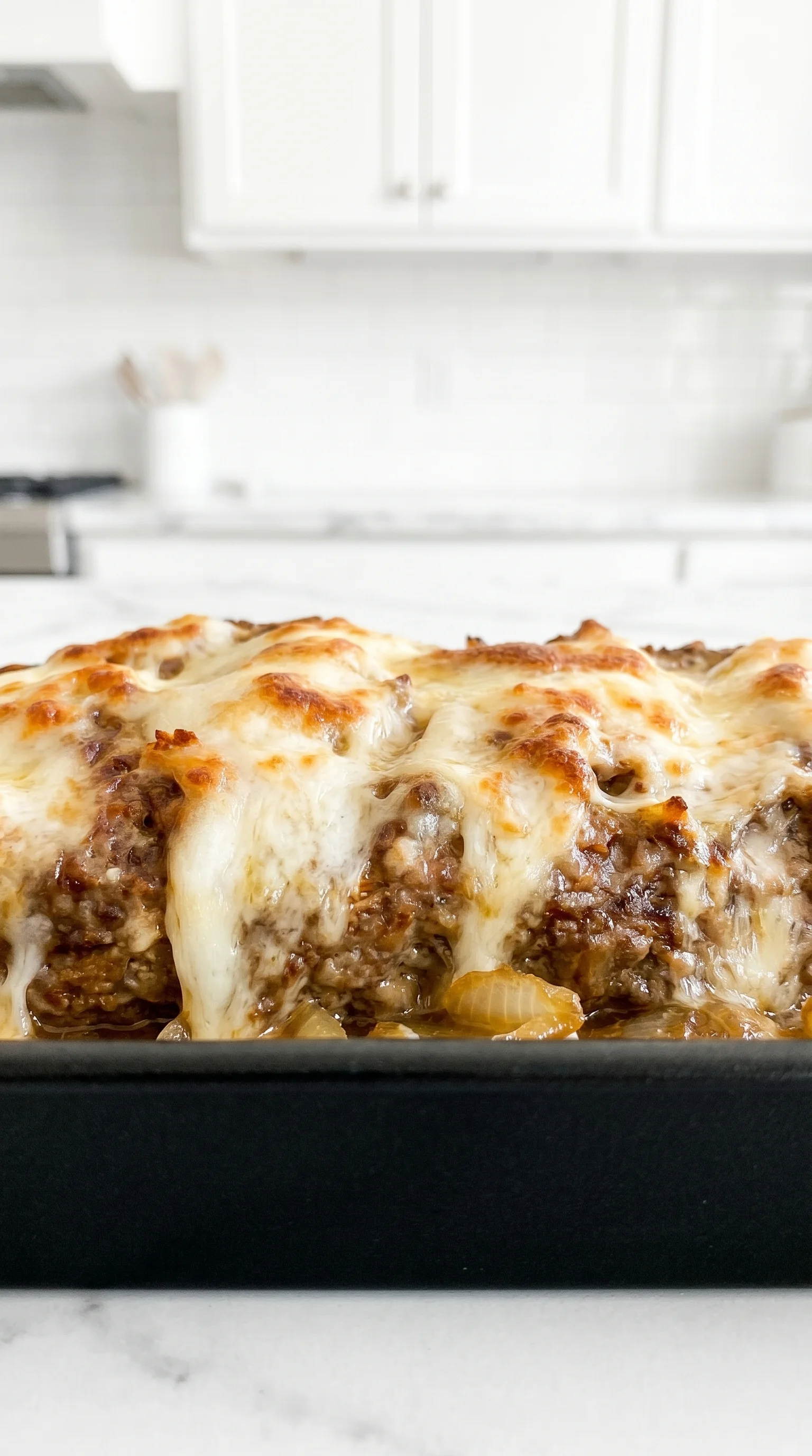 A delicious French Onion Meatloaf with Yummy Melted Swiss Cheese.