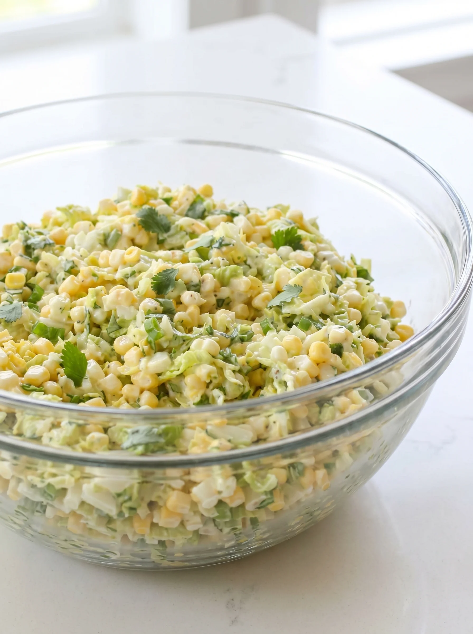 A bowl of jalapeno corn coleslaw.