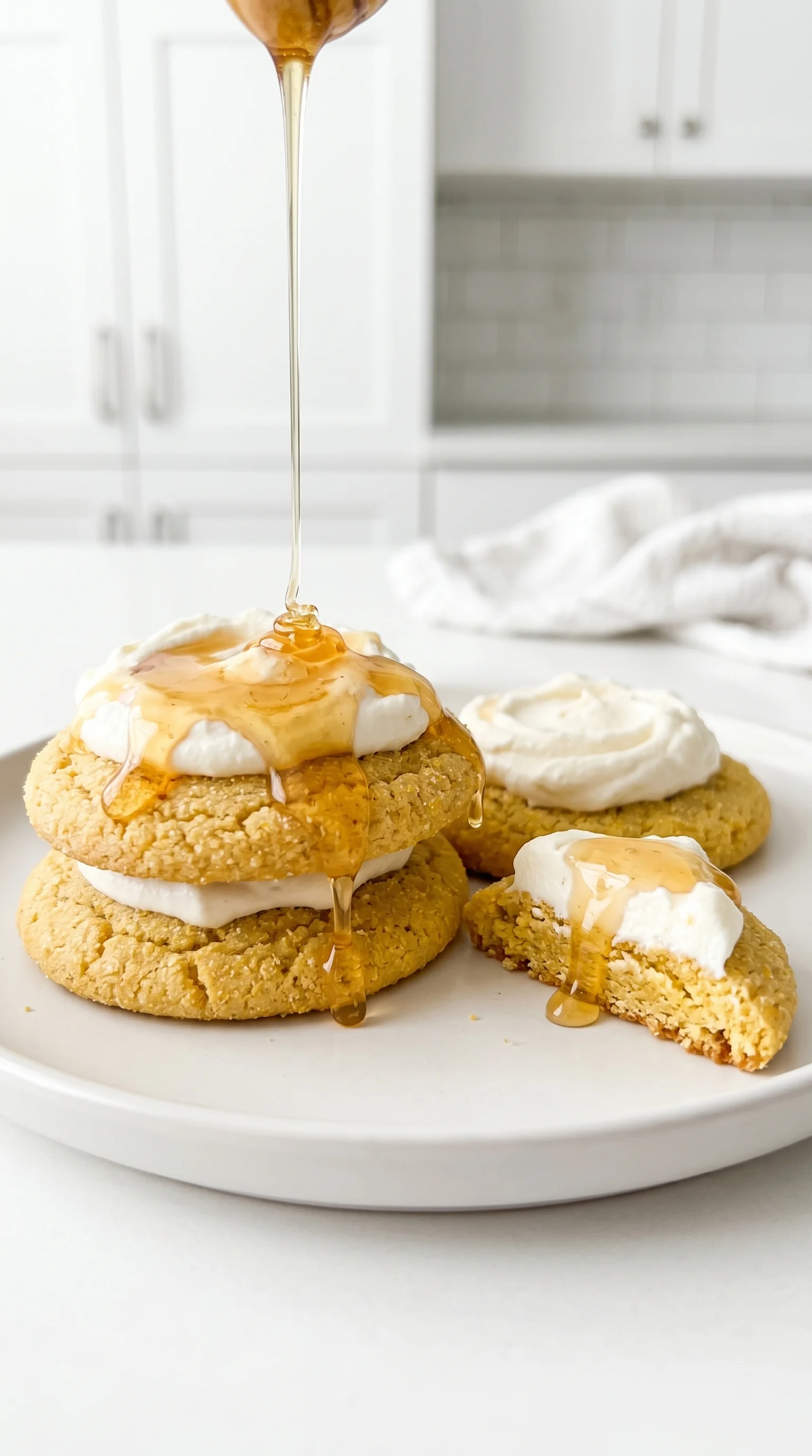 A plate of cornbread cookies with honey butter frosting.