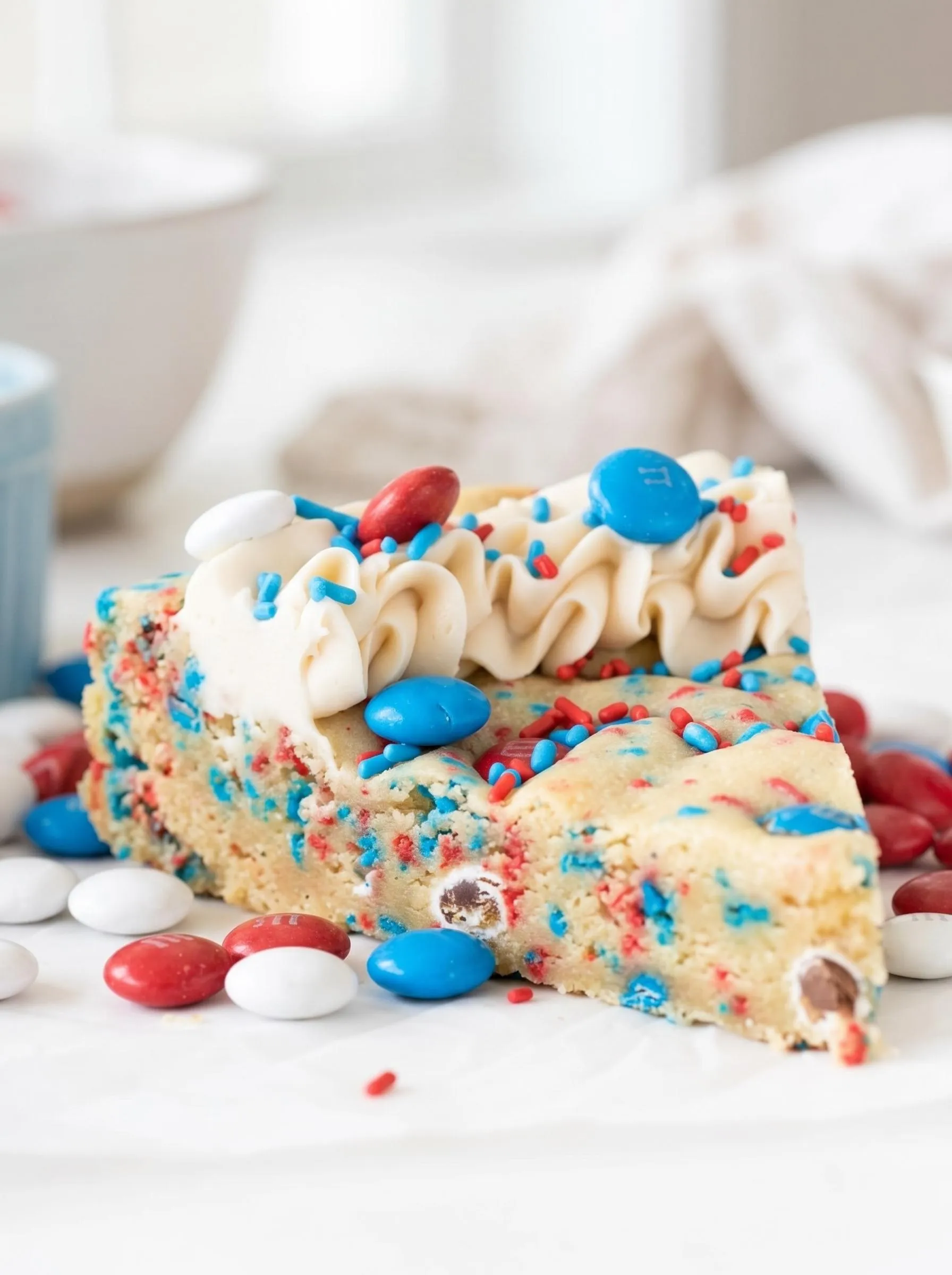 A slice of a fireworks sugar cookie cake.
