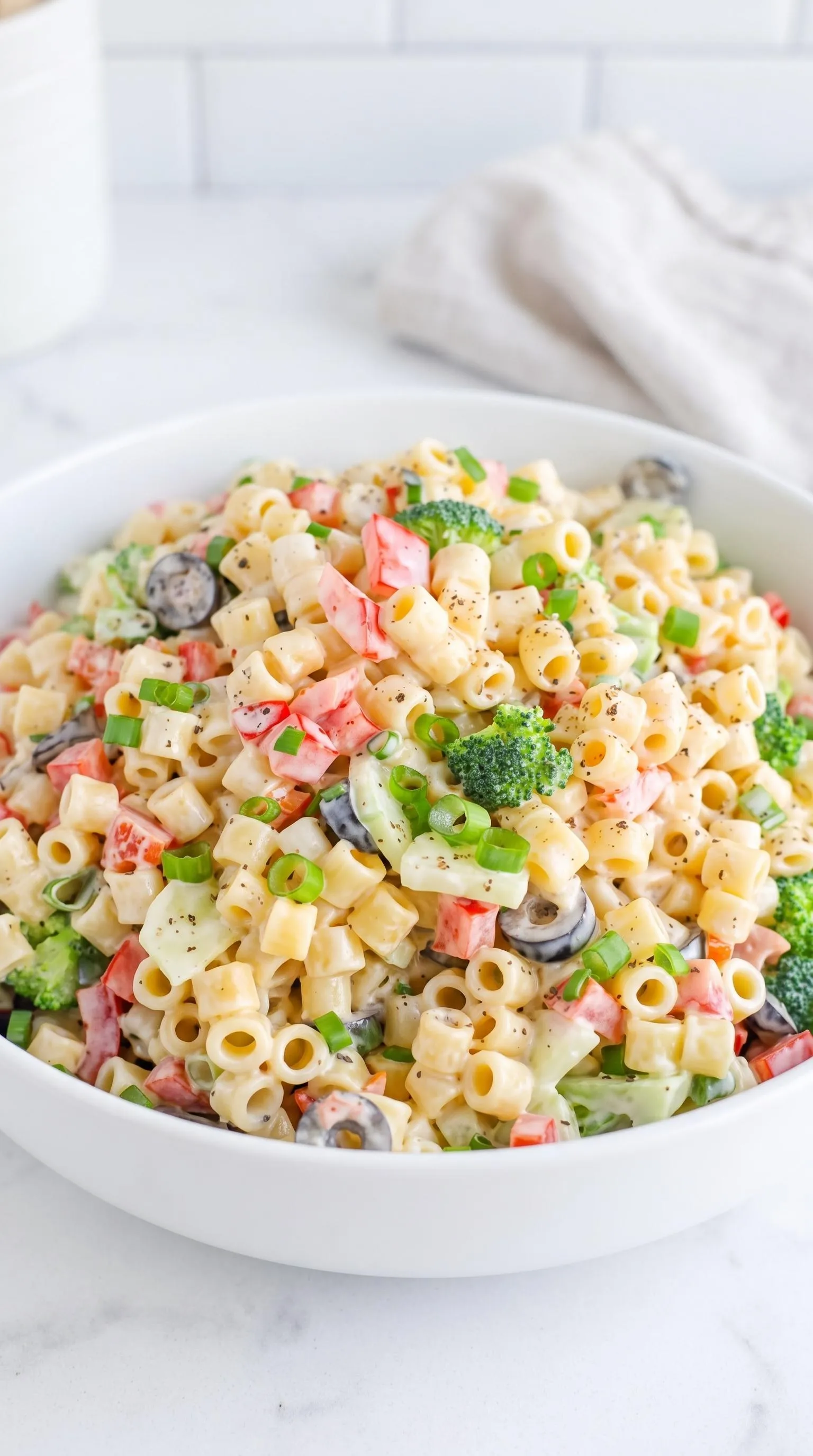 A creamy summer pasta salad in a bowl.