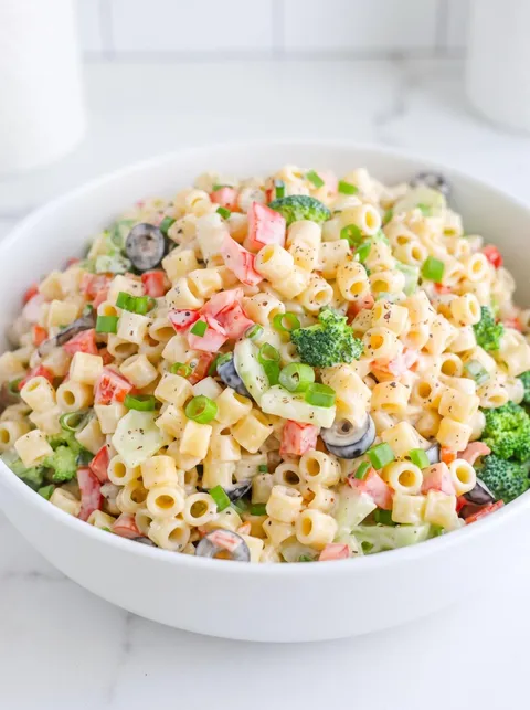 A bowl of creamy summer pasta salad.