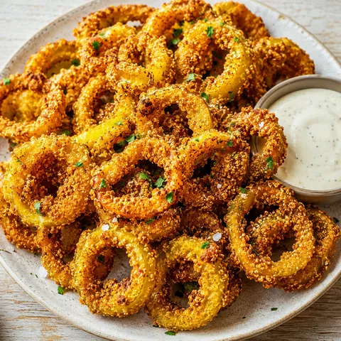Crispy fried banana peppers with smoky ranch dip and parsley