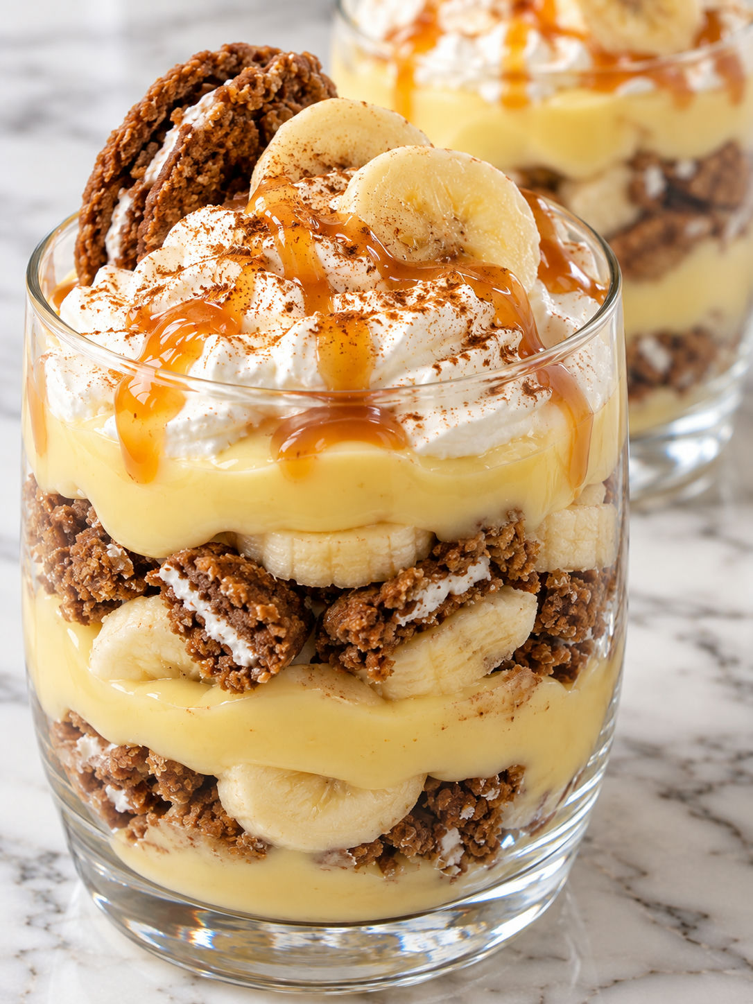 Layered oatmeal creme pie banana pudding cups with caramel