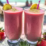 Two glasses of strawberry smoothie.
