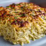 A plate of food with a lot of noodles.