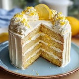 A slice of cake with lemon on top.