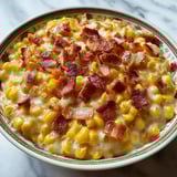 A bowl of bacon and corn.